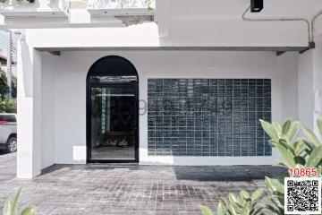 Exterior view of a modern building with a distinctive glass block window design