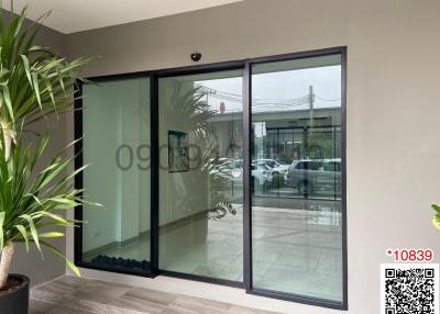 Spacious patio area with large sliding glass doors and plant decor