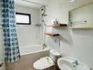 Compact bathroom with essential fixtures and patterned shower curtain