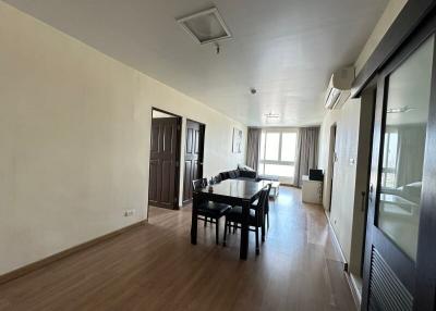 Spacious living room with dining area and balcony access