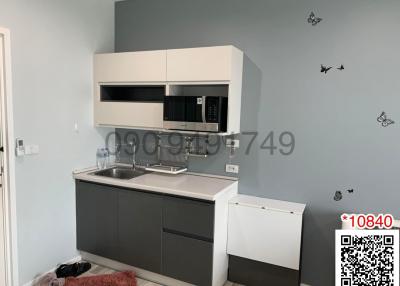 Modern kitchen with gray cabinetry and built-in appliances