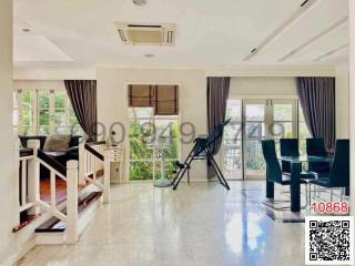 Spacious living room with natural light and modern furnishings