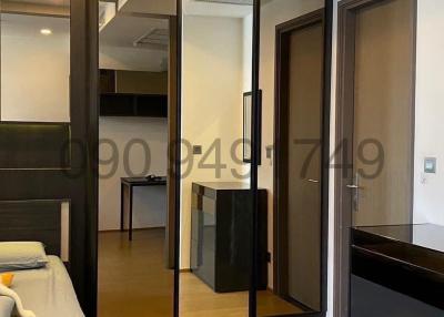 Modern bedroom with mirrored wardrobe and sleek design