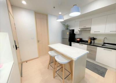 Modern kitchen with white cabinets and a central island