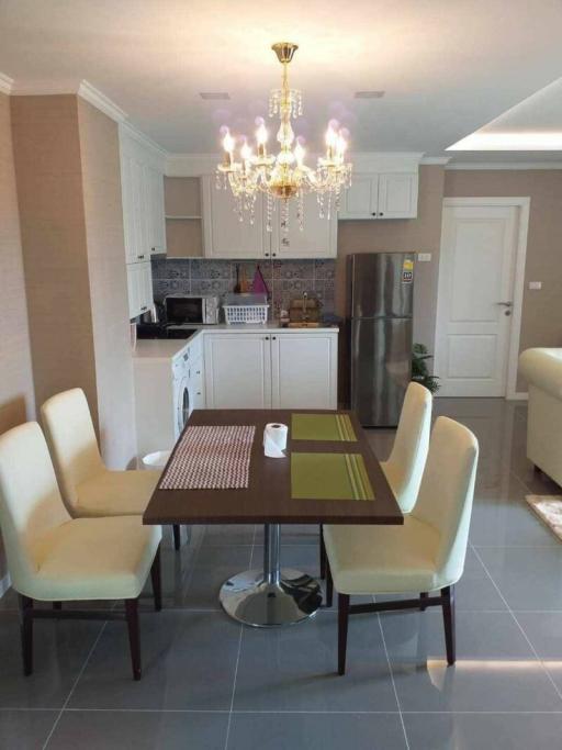 Modern kitchen with dining area and chandelier