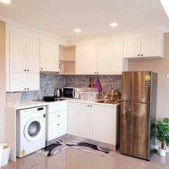 Modern kitchen with stainless steel appliances and white cabinetry