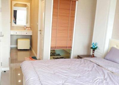 Spacious bedroom with en suite bathroom and large window