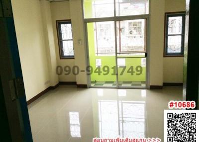 Spacious unfurnished room with glossy tiled flooring and large windows