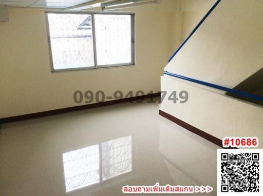 Bright empty room with tiled floor and windows