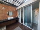 Modern bathroom with natural light and glass shower partition