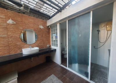 Modern bathroom with natural light and glass shower partition
