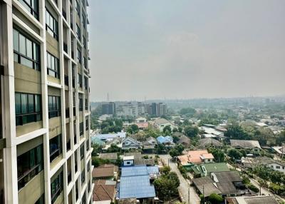 Expansive city view from a high-rise apartment building