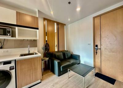 Compact modern apartment interior with integrated kitchen and living space