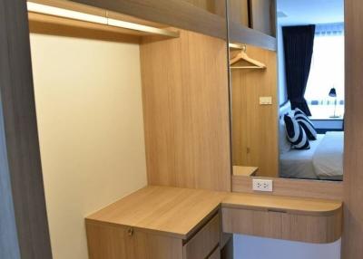 Modern bedroom with built-in wardrobe and study nook