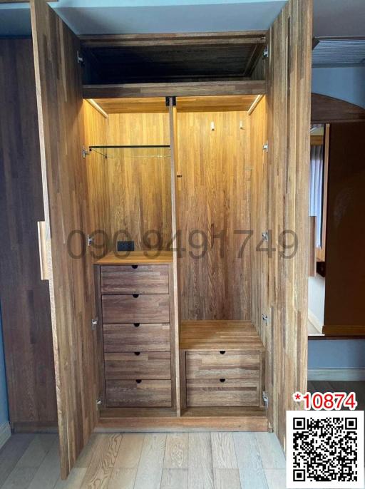Spacious wooden wardrobe in modern bedroom