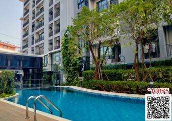 Swimming pool with greenery in a residential apartment complex