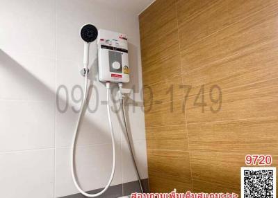 Modern bathroom with wall-mounted electric shower unit