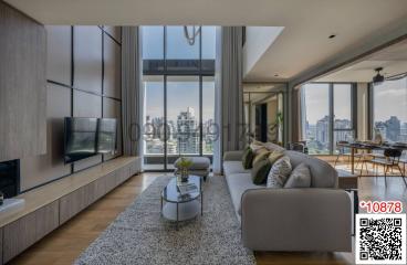 Spacious living room with modern furniture and large windows