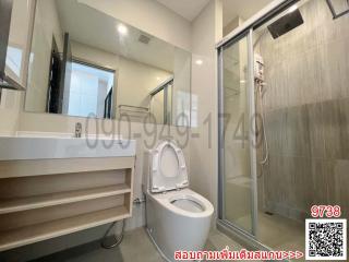 Modern bathroom interior with glass shower and vanity