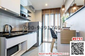 Modern kitchen with stainless steel appliances and breakfast bar