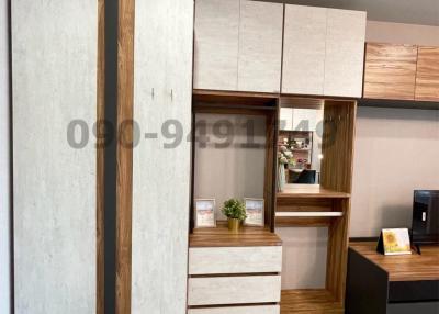 Modern bedroom with efficient storage and workspace area