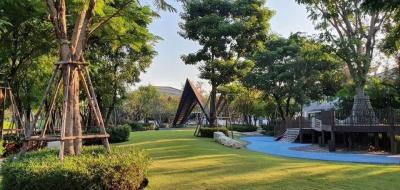 Lush green outdoor space with playground and modern landscaping