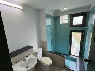 Modern bathroom with glass shower and natural light