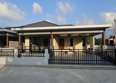 Contemporary single-story house with carport and front veranda