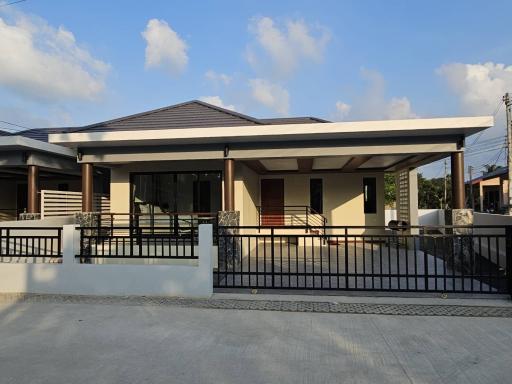 Contemporary single-story house with carport and front veranda
