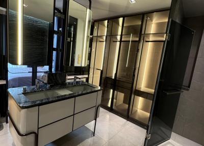 Modern bedroom with large wardrobe and vanity mirror