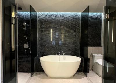 Modern bathroom with freestanding bathtub and glass shower