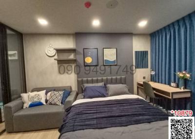 Modern bedroom with blue color accents and a neat design