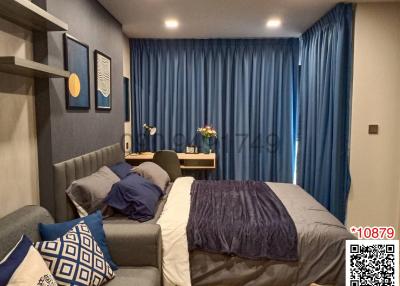 Cozy bedroom with modern decor and blue accents