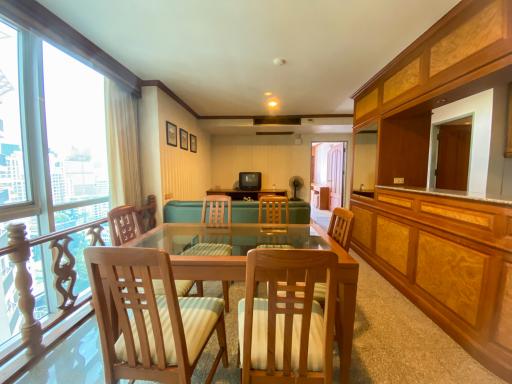 Spacious living room with dining area and city view