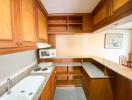 Spacious kitchen with wooden cabinets and granite countertops