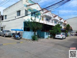 Residential street with a row of two-story townhouses