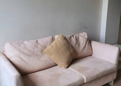 Beige sofa in a simple living room setting