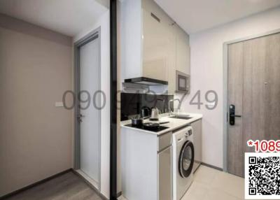 Compact modern kitchen with appliances and a washing machine