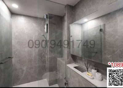 Modern bathroom with glass shower and mirrored vanity