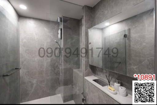 Modern bathroom with glass shower and mirrored vanity