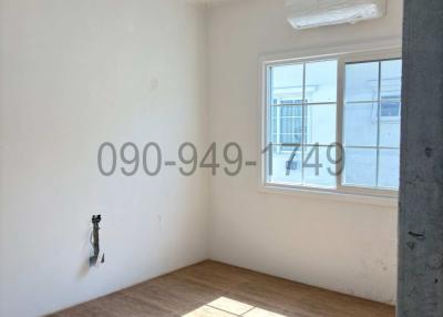 Unfurnished and bright room with large window and air conditioning unit
