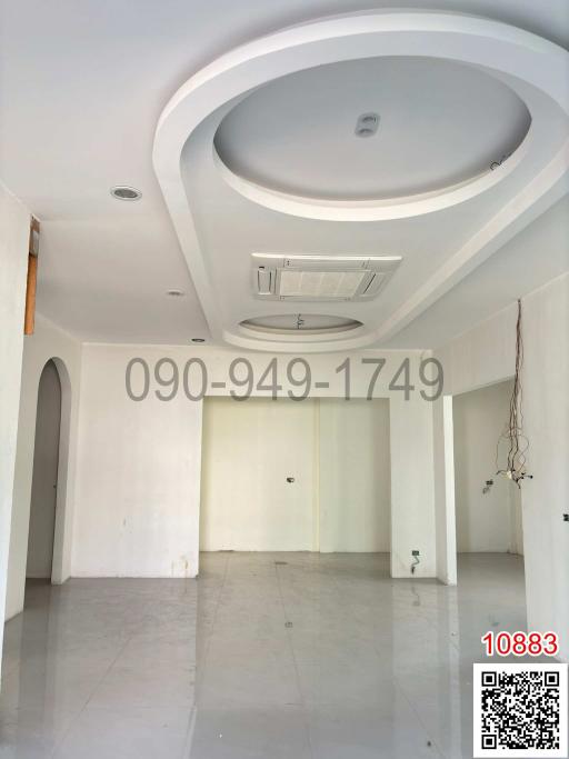 Spacious unfurnished interior with high ceiling and modern design suitable for a living room or lobby