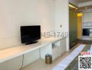 Modern living room interior with television and view to the kitchen