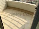 Compact balcony with city view and tiled flooring