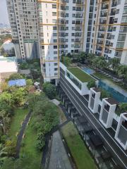 High-rise residential buildings with garden and amenities