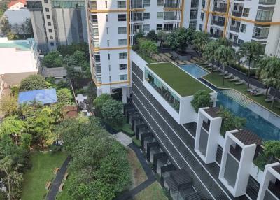 High-rise residential buildings with garden and amenities