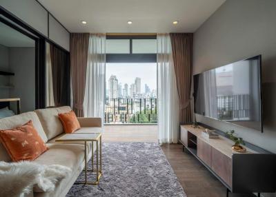 Modern living room interior with a large window overlooking the city