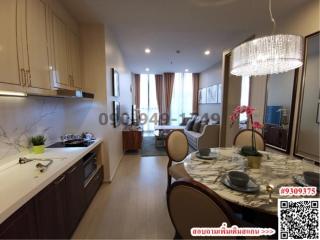 Modern kitchen with integrated dining area and marble accents