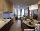 Modern kitchen with integrated dining area and marble accents