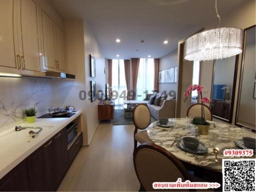 Modern kitchen with integrated dining area and marble accents